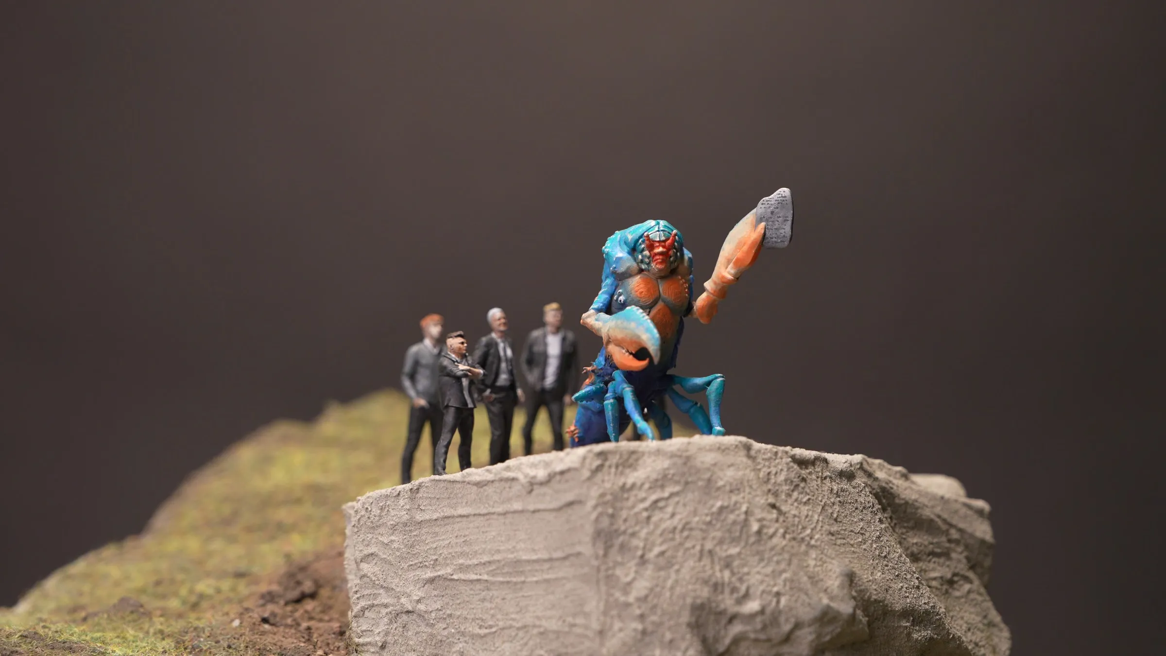 Lobster Diorama: a lobster-like preacher and his followers on top of a rock, printed in UV resin