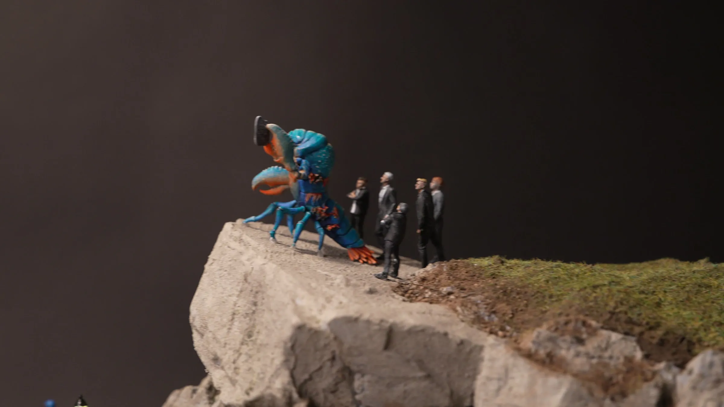 The lobster preacher at the cliff edge with his followers
