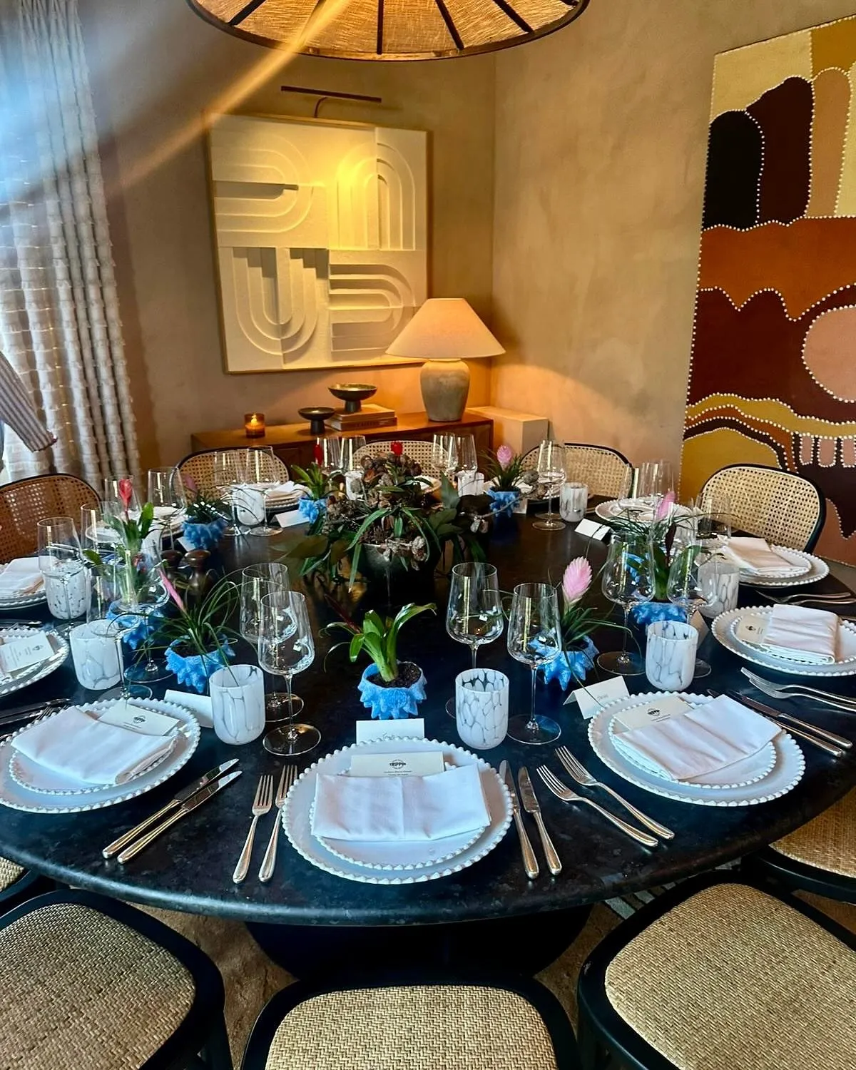 Trippin coral plant pots dressing a round dinner table